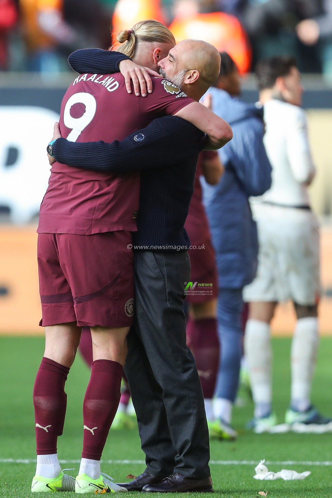 Erling Haaland of Manchester City and Pep Guardiola manager of Manchester City embrace after their teams win in the Premier League match Wolverhampton Wanderers vs Manchester City at Molineux, Wolverhampton, United Kingdom, 20th October 2024

(Photo by Gareth Evans/News Images)