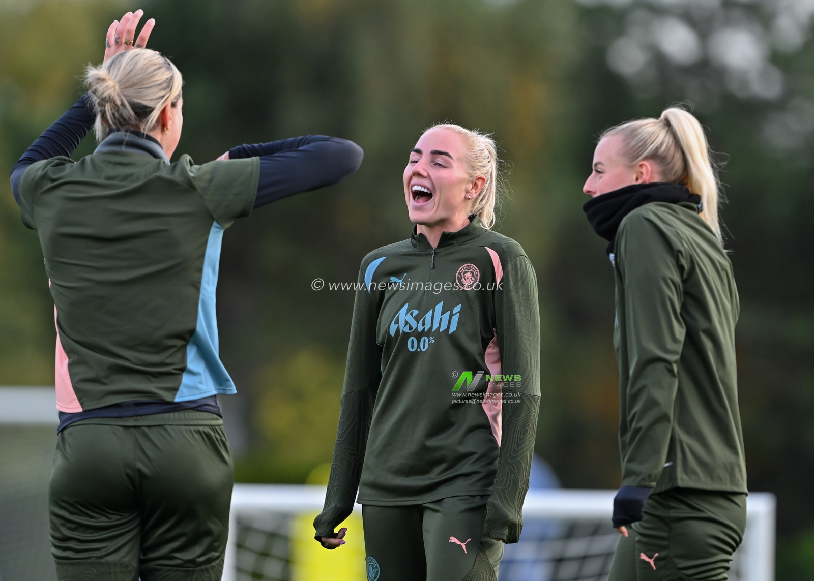 Alex Greenwood of Manchester City Women shares a joke with Alanna Kennedy of Manchester City Women and Chloe Kelly of Manchester City Women during Manchester City Women Champions league open training session at Joie Stadium, Manchester, United Kingdom, 8th October 2024

(Photo by Cody Froggatt/News Images)