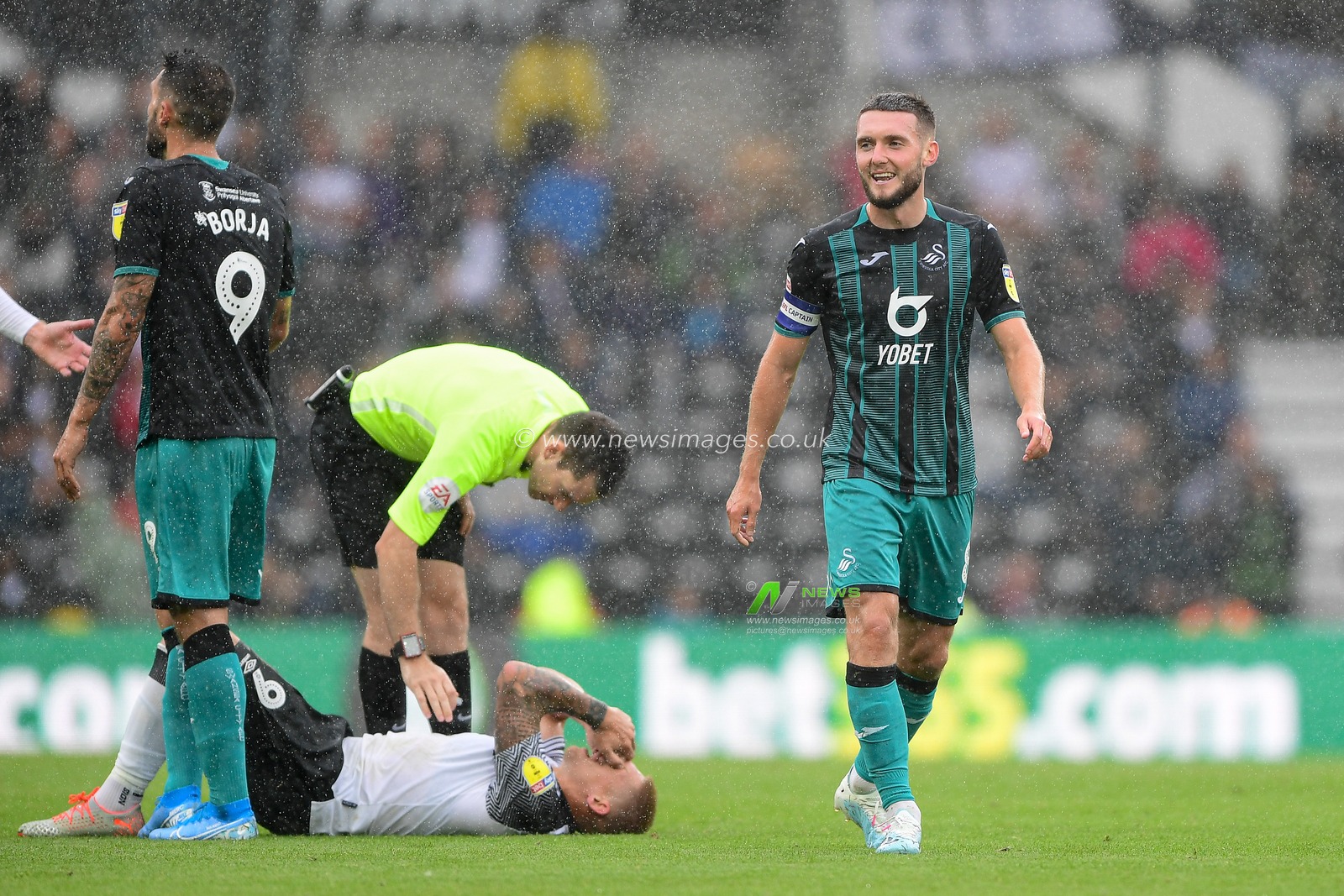 10th August 2019, Pride Park, Derby, England; Sky Bet Championship, Derby County vs Swansea City ; Matt Grimes (8) of Swansea walks away smiling after fouling Martyn Waghorn (9) of Derby County 

Credit: Jon Hobley/News Images 

English Football League images are subject to DataCo Licence
