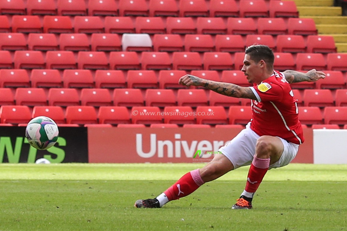 Dominic Frieser (28) of Barnsley takes a shot at goal