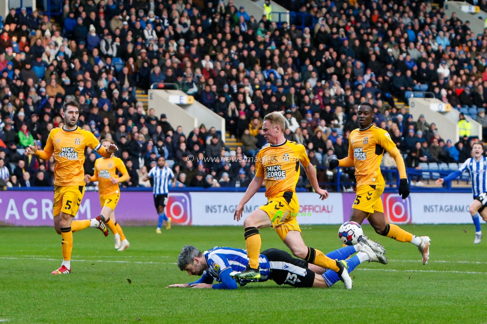 Liam Bennett #28 of Cambridge United fouls Callum Paterson #13 of Sheffield Wednesday to give away a penalty during the Sky Bet League 1 match Sheffield Wednesday vs Cambridge United at Hillsborough, Sheffield, United Kingdom, 2nd January 2023

(Photo by Ben Early/News Images)