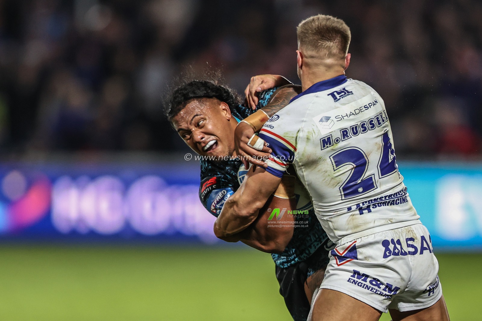 Tesi Niu of Leigh Leopards is tackled by Matty Russell of Wakefield Trinity during the Betfred Challenge Cup Quarter Final match Wakefield Trinity vs Leigh Leopards at DIY Kitchens Stadium, Wakefield, United Kingdom, 4th April 2025

(Photo by Alfie Cosgrove/News Images)