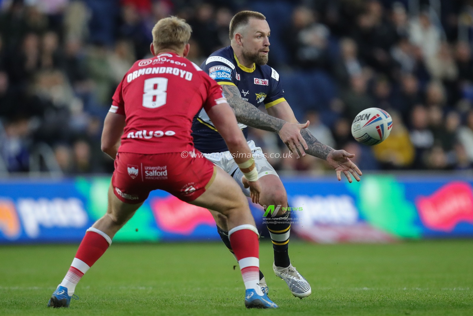 Blake Austin #6 of Leeds Rhinos passes the ball during the Betfred Super League Round 11 match Leeds Rhinos vs Salford Red Devils at Headingley Stadium, Leeds, United Kingdom, 5th May 2023

(Photo by James Heaton/News Images)