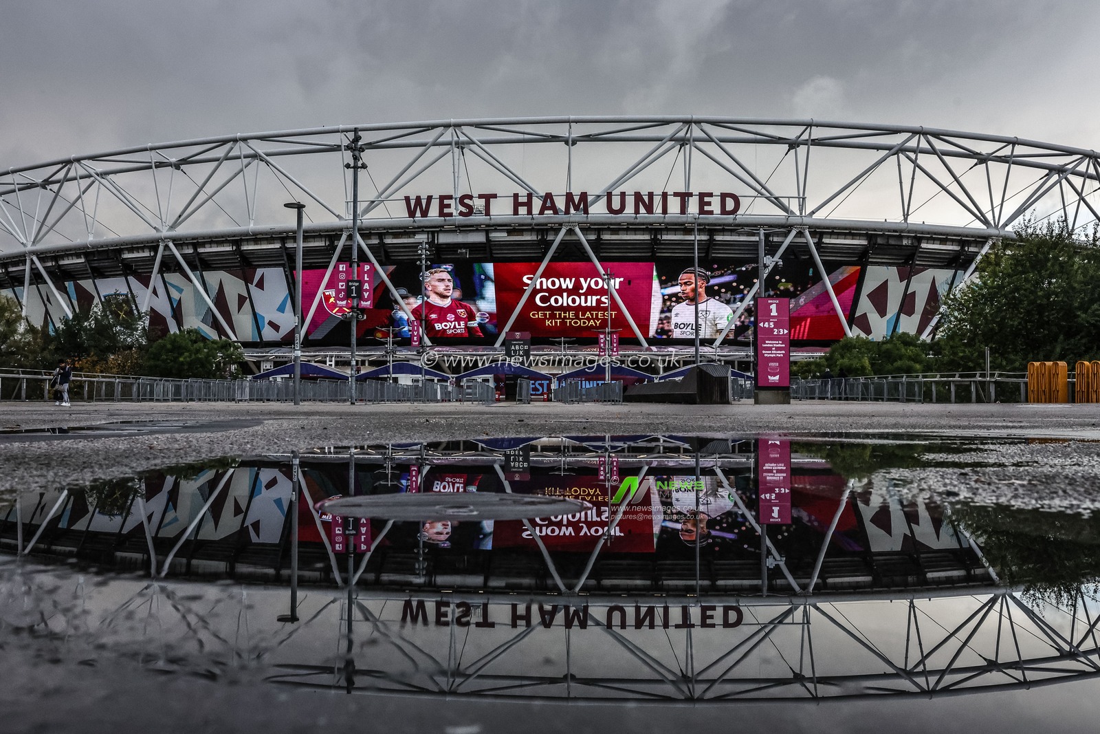 A reflection of the London Stadium through a puddle during the Premier League match West Ham United vs Brentford at London Stadium, London, United Kingdom, 20th October 2025

(Photo by Mark Cosgrove/News Images)