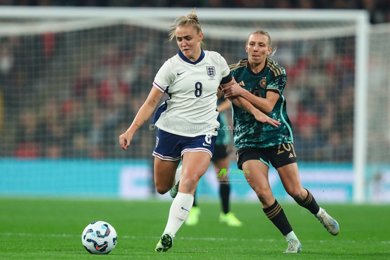 Georgia Stanway of England goes forward with the ball whilst getting pressured by Elisa SenÃŸ of Germany during the International Friendly match England Women vs Germany Women at Wembley Stadium, London, United Kingdom, 25th October 2024

(Photo by Izzy Poles/News Images)