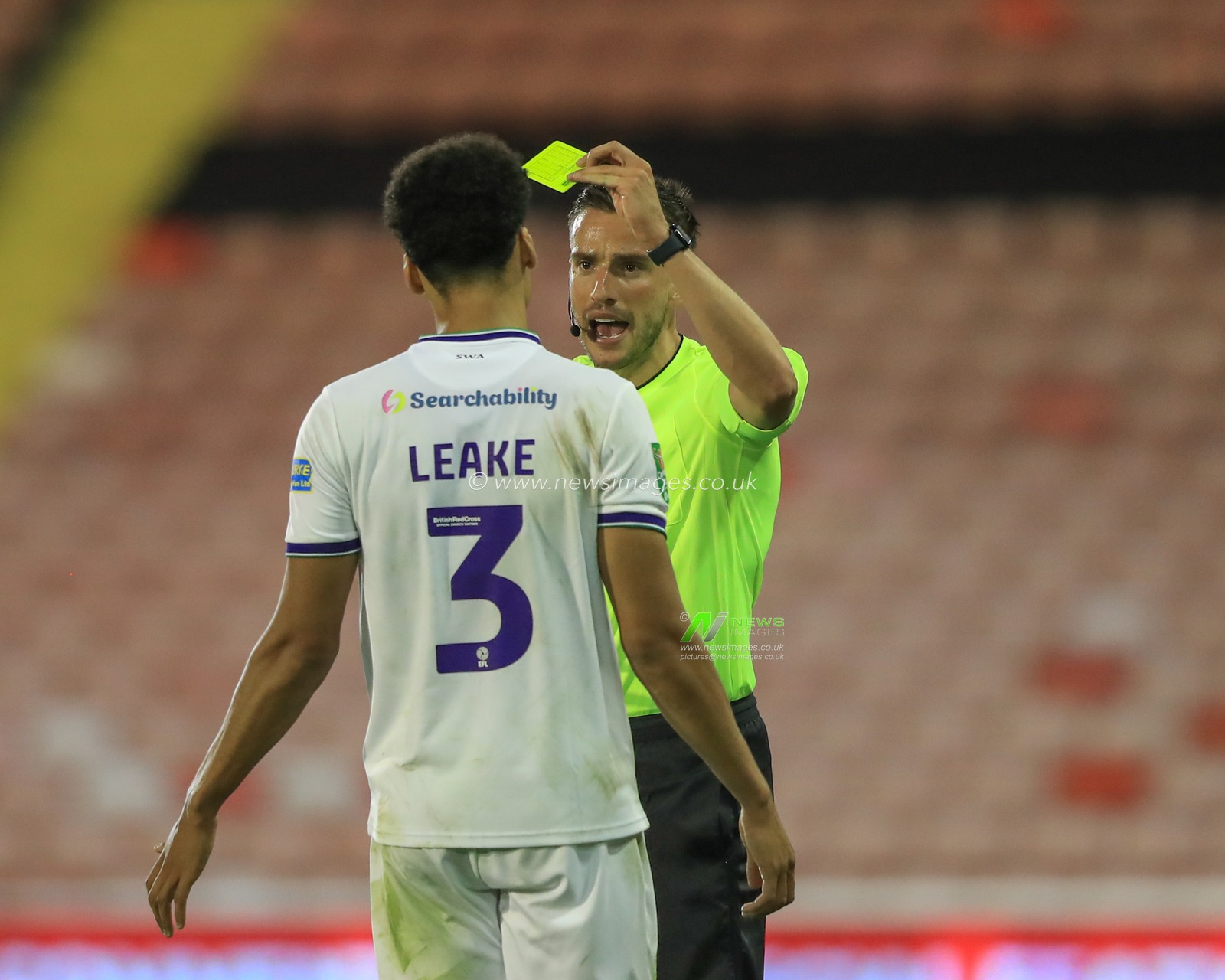 referee Thomas Kirk gives a yellow card to Jake Leake of Tranmere Rovers during the Carabao Cup match Barnsley vs Tranmere Rovers at Oakwell, Barnsley, United Kingdom, 8th August 2023

(Photo by Alfie Cosgrove/News Images)