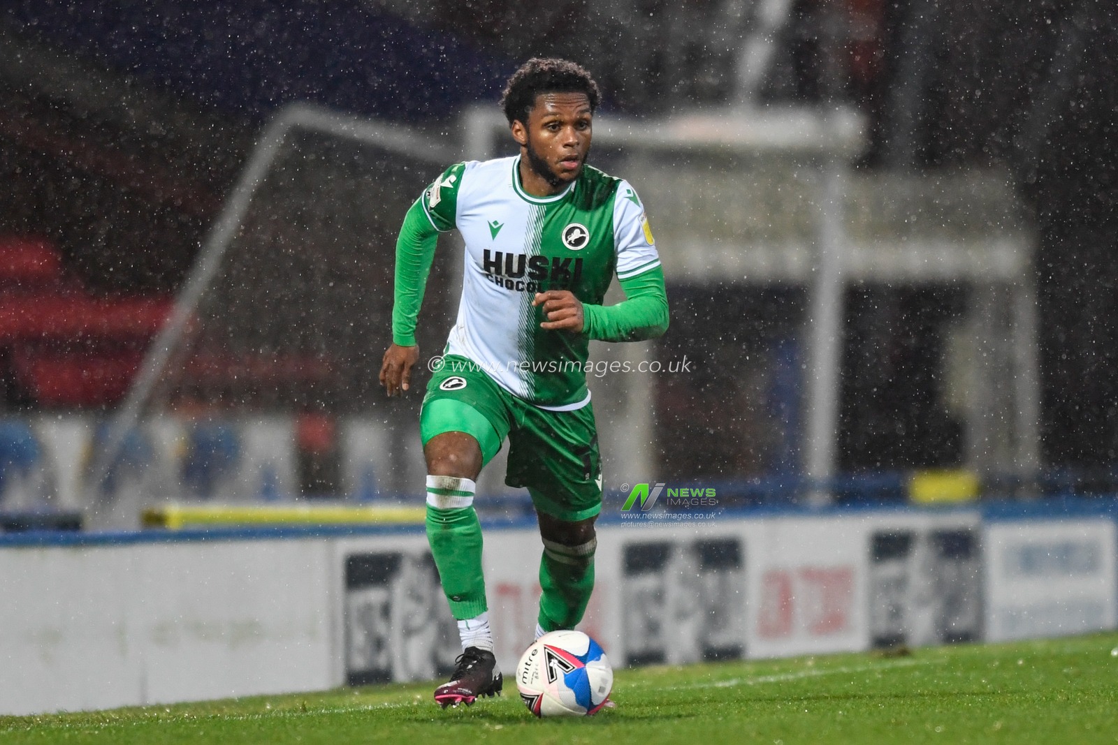 Mahlon Romeo #12 of Millwall runs forward with the ball