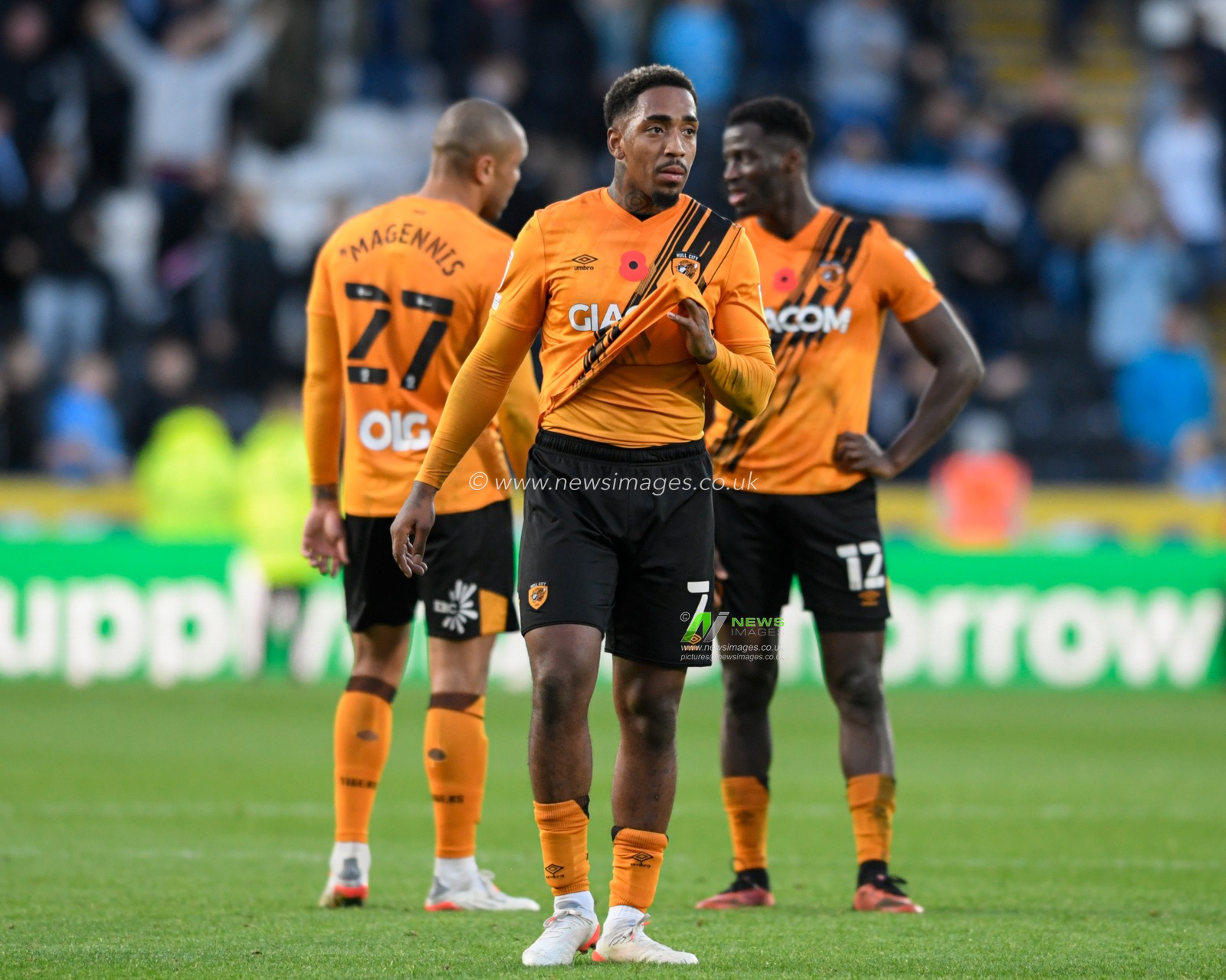 Mallik Wilks #7 of Hull City, Josh Emmanuel #12 of Hull City and Josh Magennis #27 of Hull City react to losing 0-1 to Coventry City after the final whistle