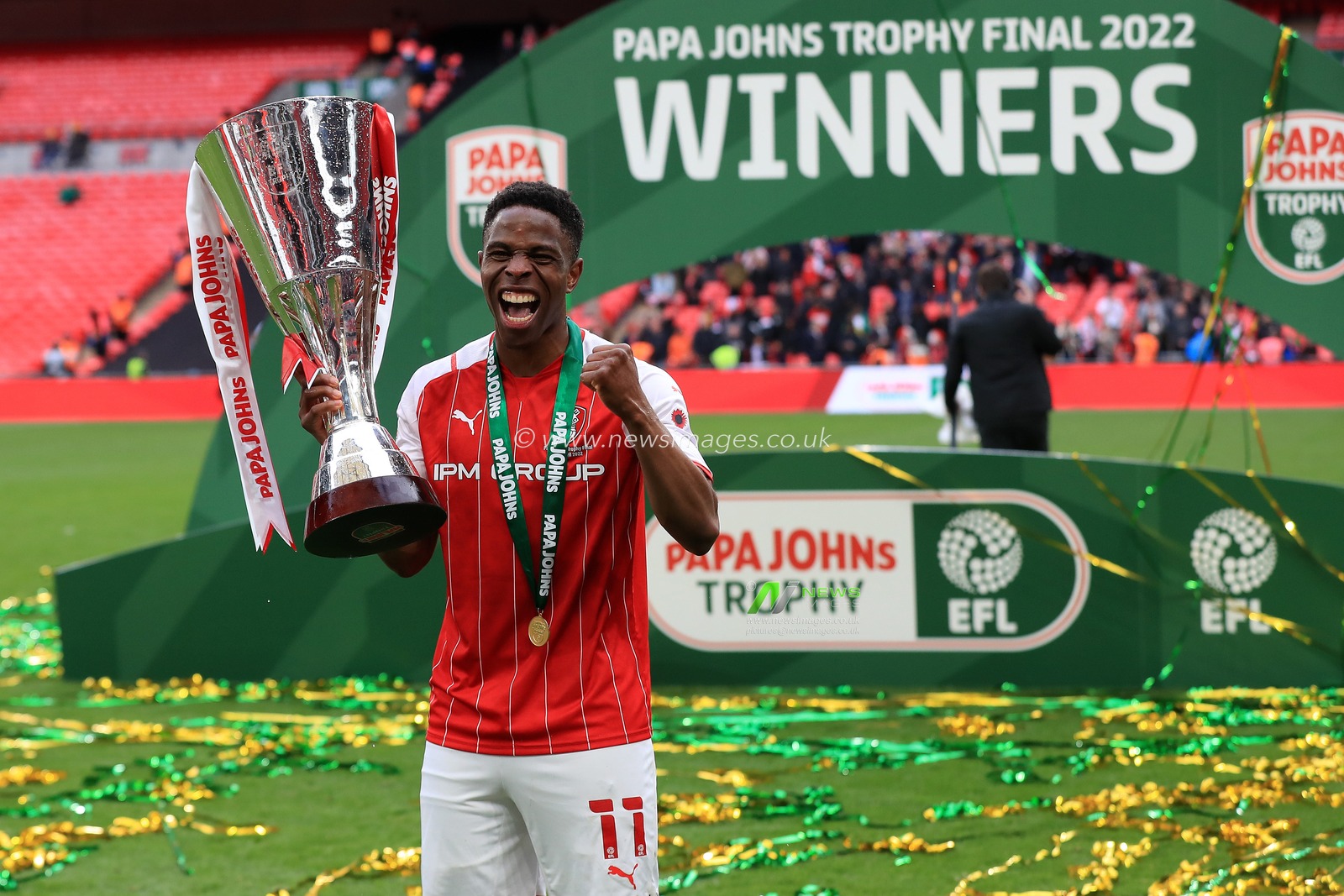 Goalscorer Chiedozie Ogbene #11 of Rotherham United celebrates with the trophy.