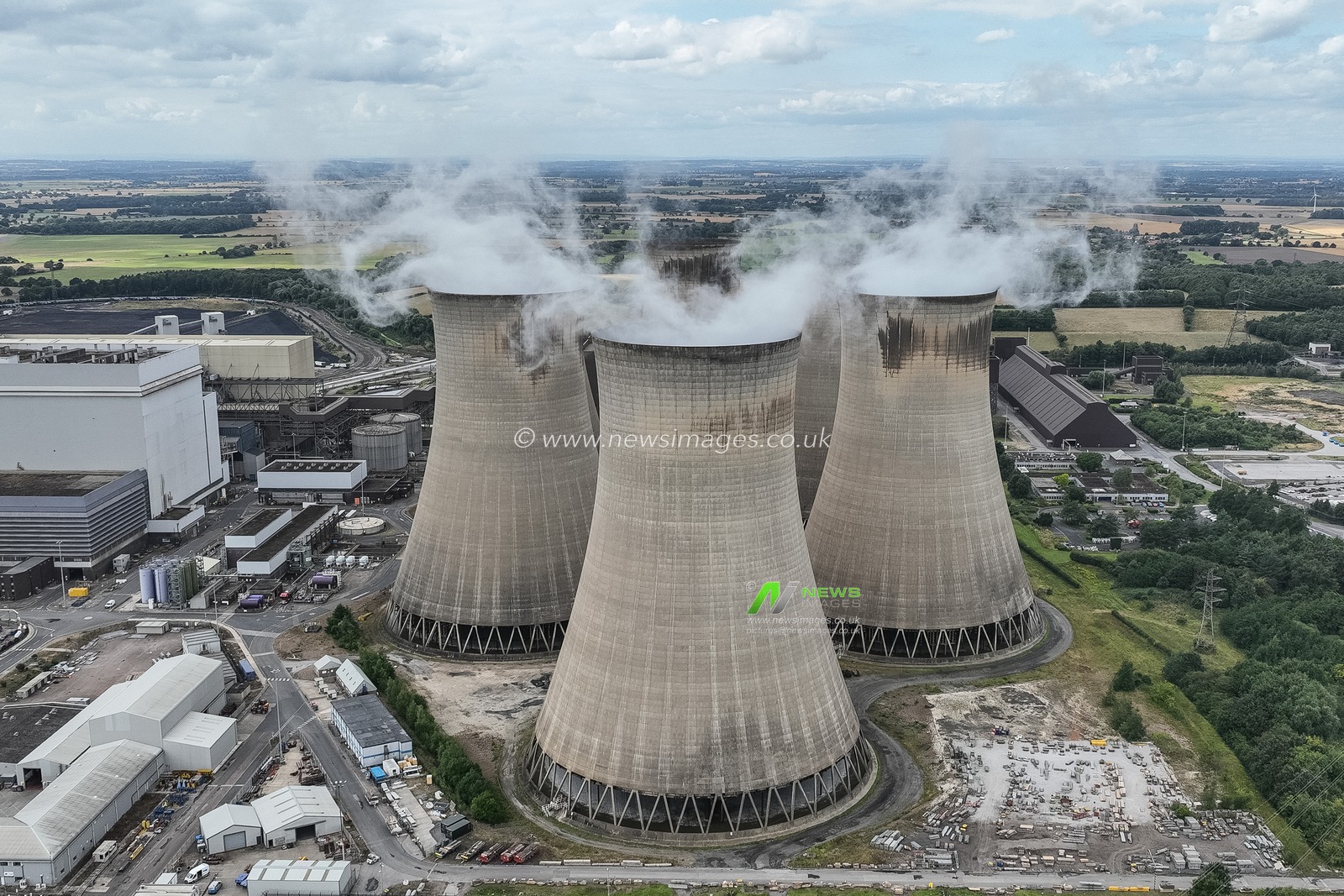An aerial view of Drax Power Station. Drax Power Station is responsible for generating 11% of the renewable energy in the UK. It offers a secure, dependable, and adaptable source of renewable energy, which helps to complement more variable sources such as wind and solar power. Located near Selby in North Yorkshire, Drax is the largest single renewable energy site in the country, producing approximately 14 terawatt-hours (TWh) of electricityâ€”enough to supply power to around five million homes. 

By utilising biomass pellets, Drax significantly lowers its carbon emissions by 80% when compared to traditional coal. The facility comprises four biomass-fired units, each with a capacity of 645MW, contributing to its total output of about 14 terawatt-hours (TWh) at Drax Power Station, Selby, United Kingdom, 16th August 2024

(Photo by Mark Cosgrove/News Images)