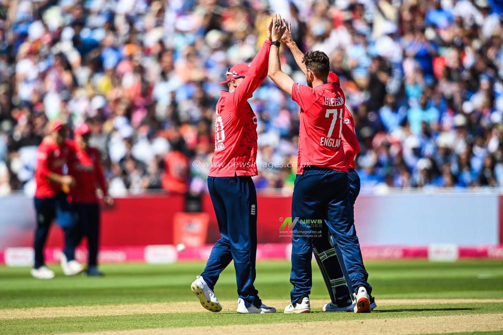 Richard Gleeson of England celebrates the wicket of Virat Kohli of India