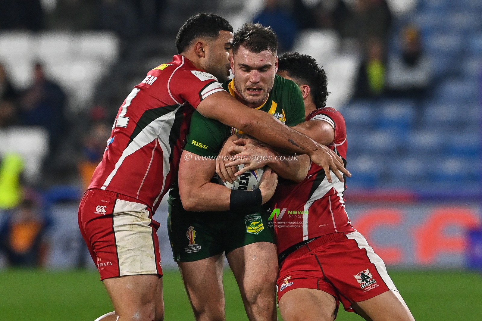 Angus Crichton of Australia is tackled by Elie El-Zakhem and Brandon Morkos of Lebanon during the Rugby League World Cup 2021 Quarter Final match Australia vs Lebanon at John Smith's Stadium, Huddersfield, United Kingdom, 4th November 2022

(Photo by Craig Thomas/News Images)