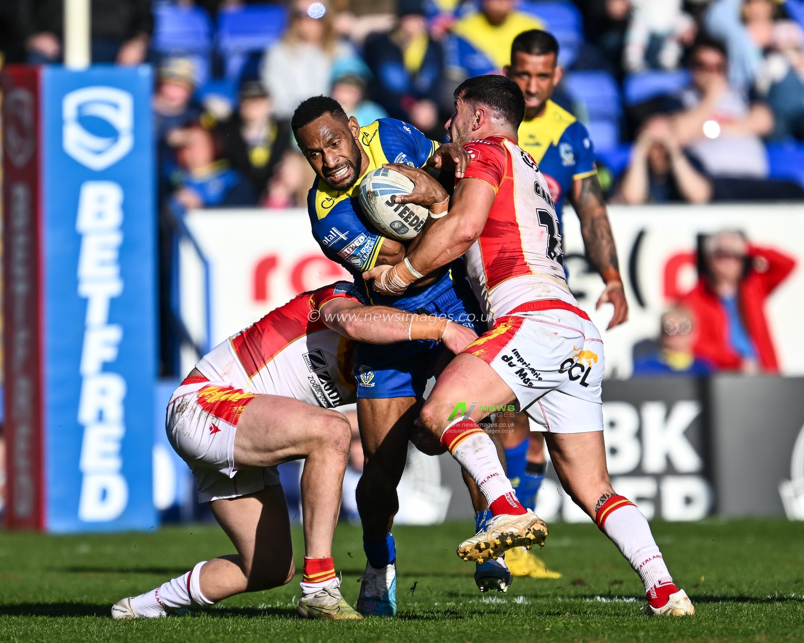 Rodrick Tai of Warrington Wolves is tackled by Tom Davies of Catalan Dragons and Ben Garcia of Catalan Dragons during the Betfred Super League match Warrington Wolves vs Catalans Dragons at Halliwell Jones Stadium, Warrington, United Kingdom, 30th March 2024

(Photo by Craig Thomas/News Images)