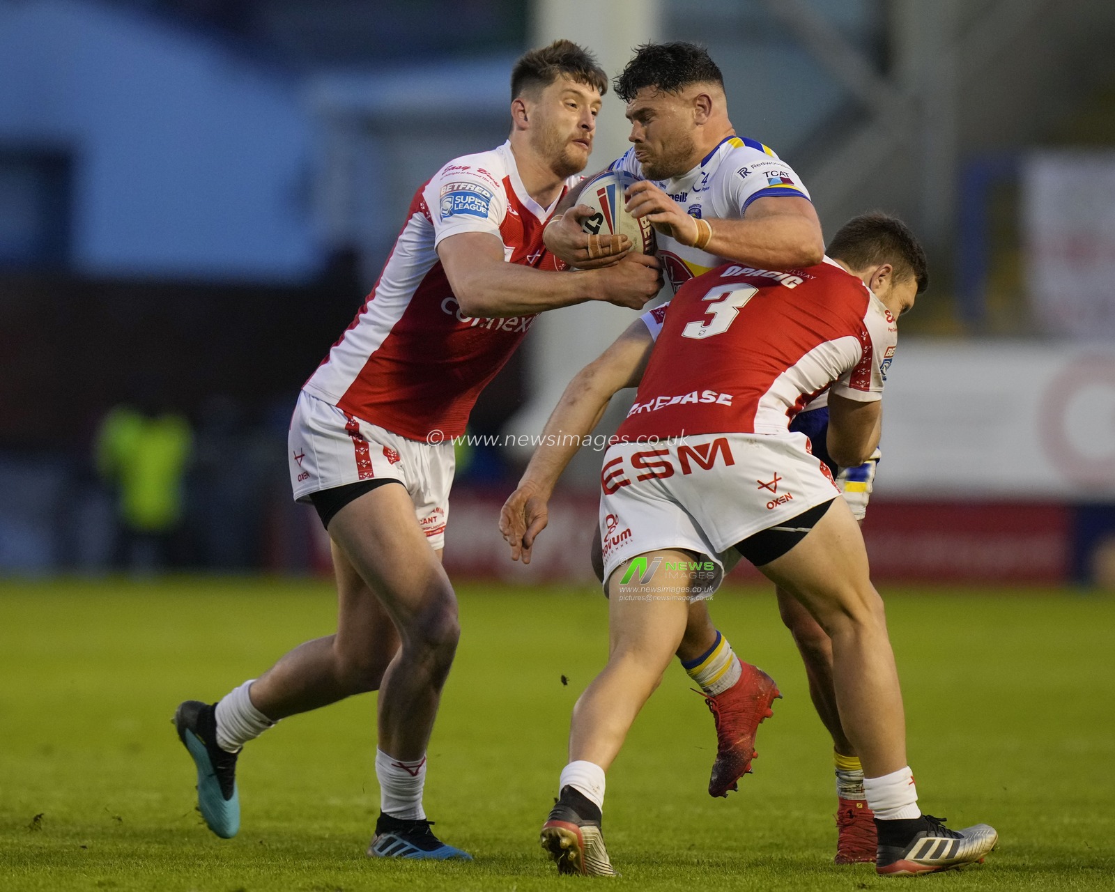 Sam Wood #24 of Hull KR and Tom Opacic #3 of Hull KR tackled by nJoe Philbin #15 of Warrington Wolves during the Betfred Super LeagueRound 12 match Warrington Wolves vs Hull KR at Halliwell Jones Stadium, Warrington, United Kingdom, 12th May 2023

(Photo by Steve Flynn/News Images)