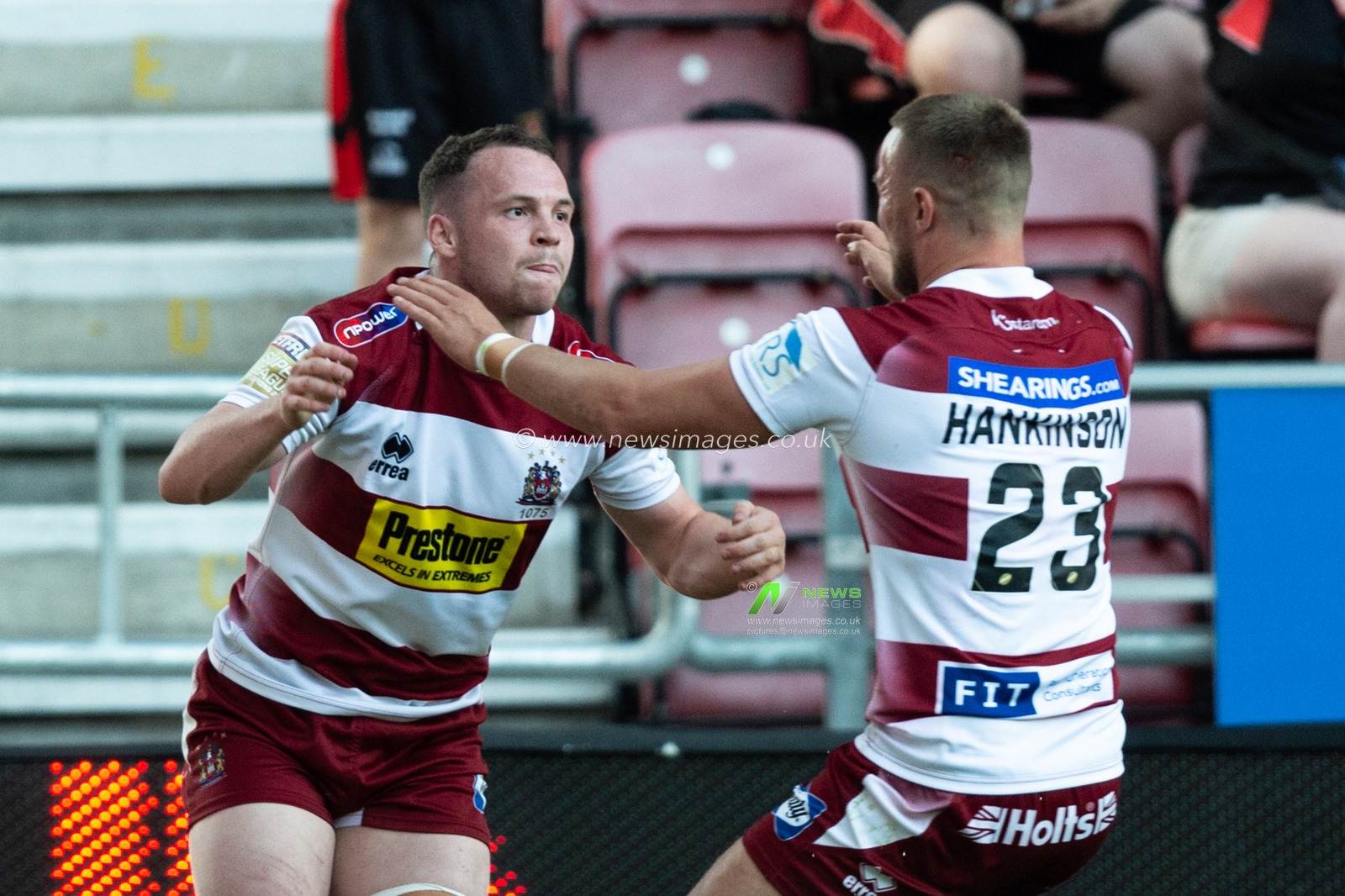 28th June 2019 , DW Stadium, Wigan, England;  Betfred Super League, Round 20, Wigan Warriors vs Salford Red Devils ; Liam Marshall (17) of Wigan Warriors celebrates his try with Chris Hankinson (23) of Wigan Warriors

Credit: Richard Long/News Images
