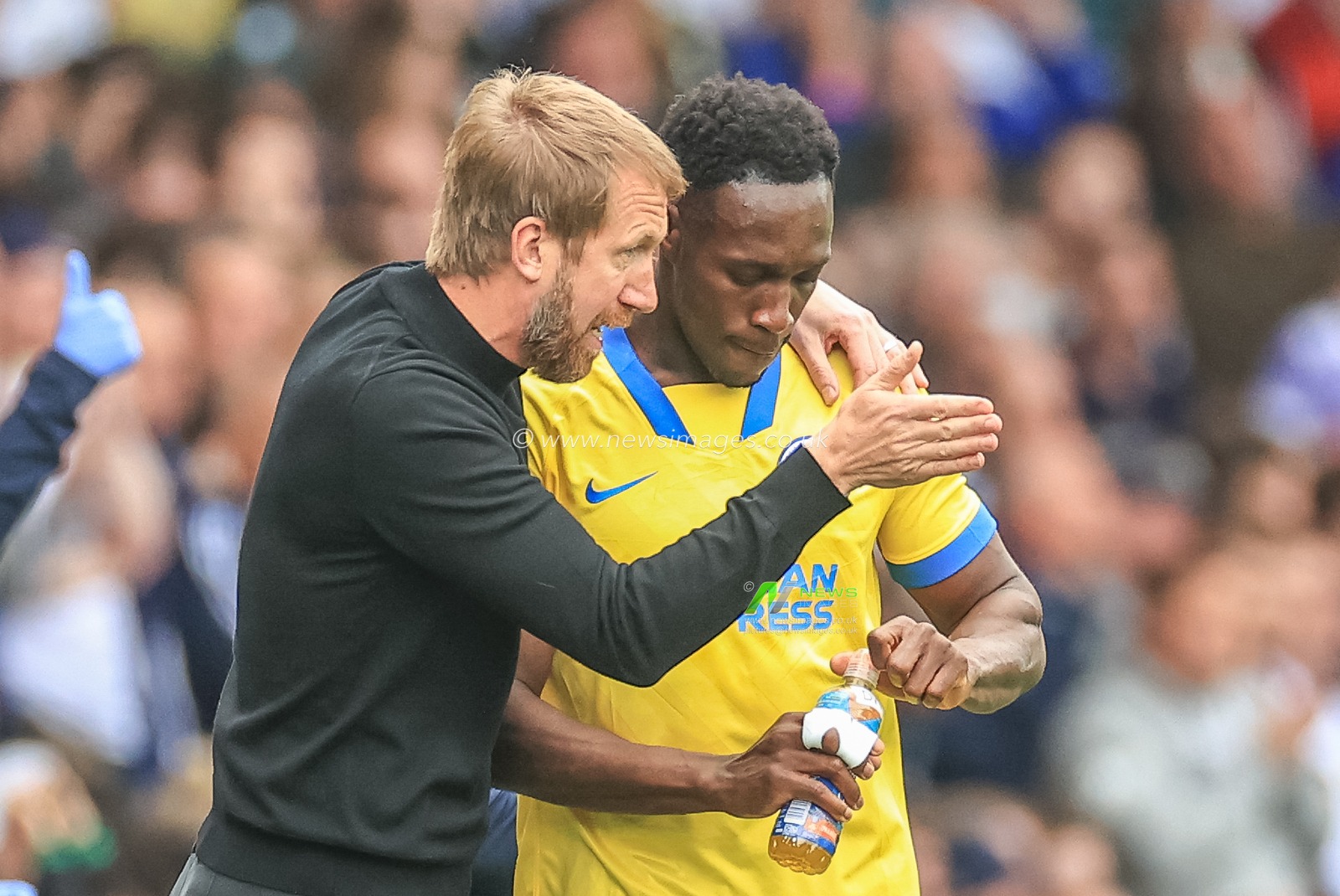 Graham Potter manager of Brighton & Hove Albion gives instructions to Danny Welbeck #18 of Brighton & Hove Albion