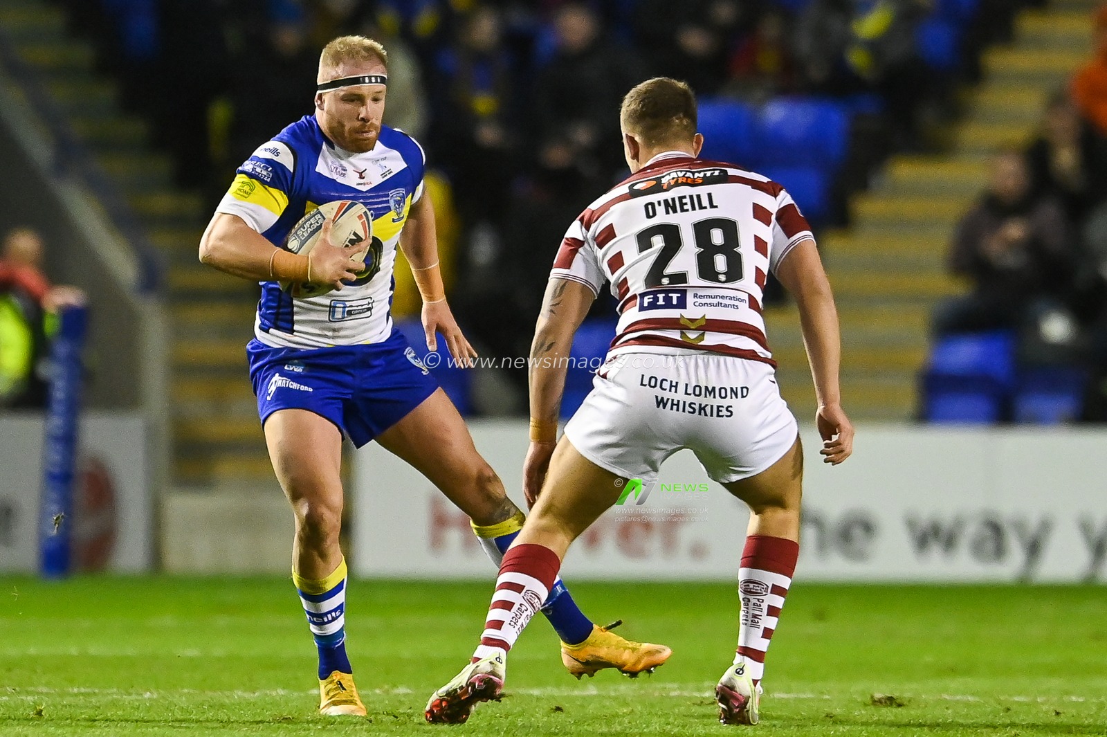 Oliver Holmes (12) of Warrington Wolves in action