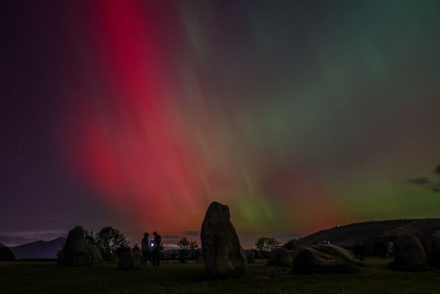Northern Lights also know as the Aurora Borealis shines over Castlerigg Stone Circle