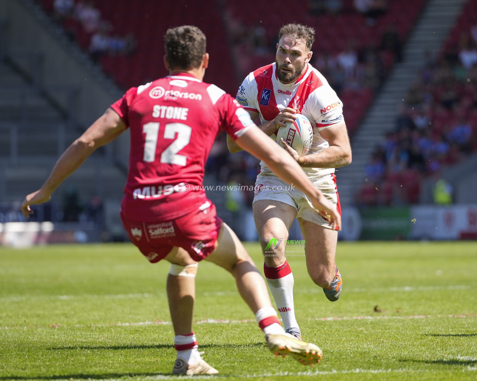 Alex Walmsley #8 of St. Helens runs at Sam Stone #12 of Salford Red Devils during the Betfred Super League Round 12 match St Helens vs Salford Red Devils at Totally Wicked Stadium, St Helens, United Kingdom, 13th May 2023

(Photo by Steve Flynn/News Images)