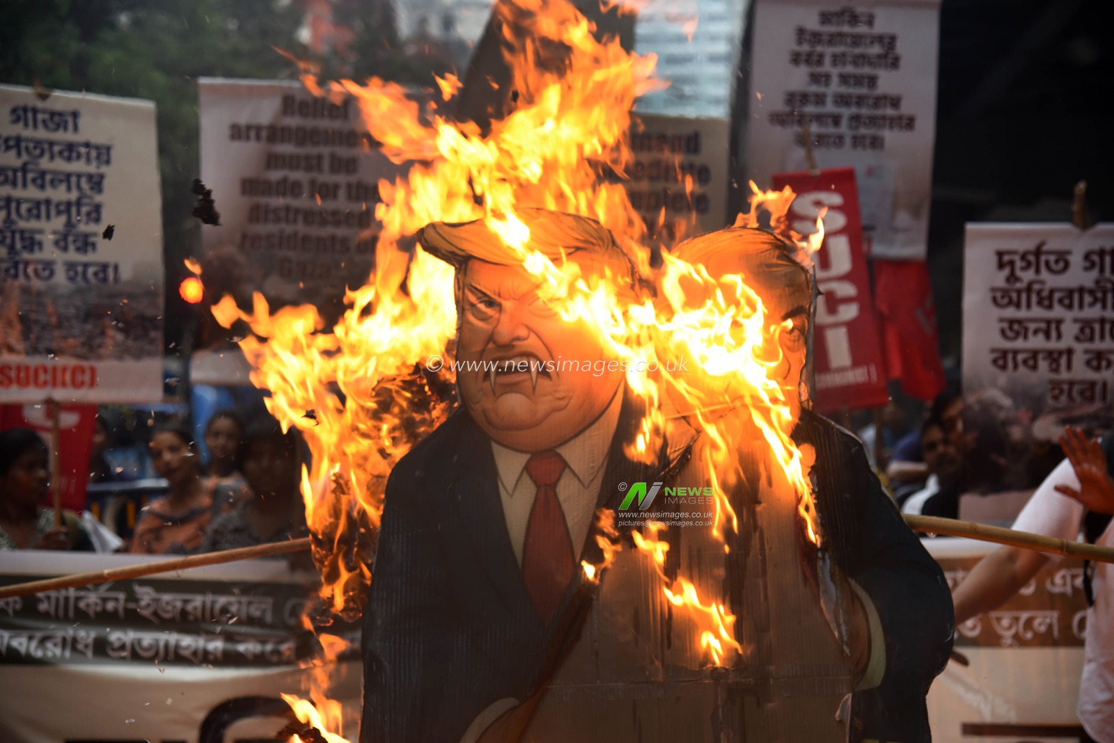 Activists of Social Unity Center of India (SUCI) hold placards and an effigy of US President Donald Trump and Israel's Prime Minister Benjamin Netanyahu during a protest against Western policy in the Israel-Hamas conflict, near US Embassy in Kolkata, Eastern India, 07 October 2025.Photo by Debajyoti Chakraborty.(Photo: Debajyoti Chakraborty/News Images)