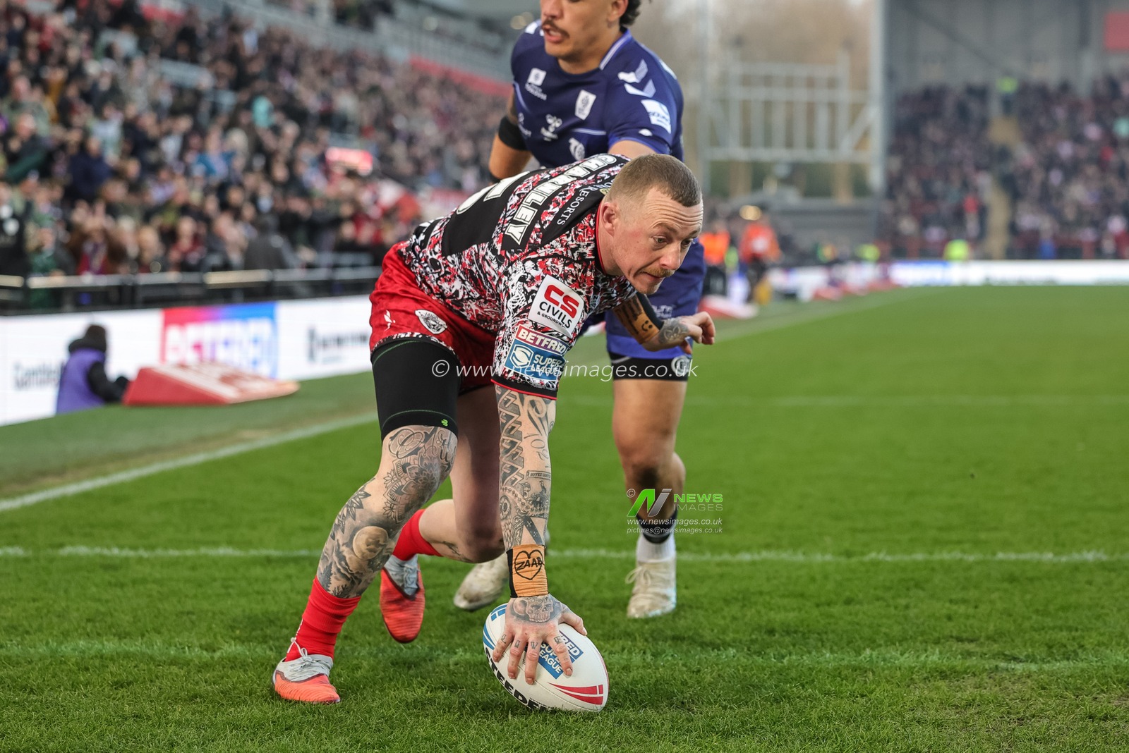 Josh Charnley of Leigh Leopards goes over for a try during the Betfred Super League round 6 match Leigh Leopards vs Toulouse at Leigh Sports Village, Leigh, United Kingdom on 28 March 2026

(Photo by Mark Cosgrove/News Images)