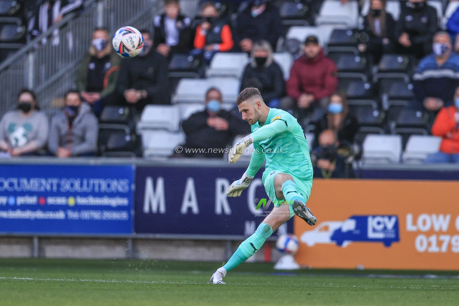 Bradley Collins #40 of Barnsley kicks the ball down field