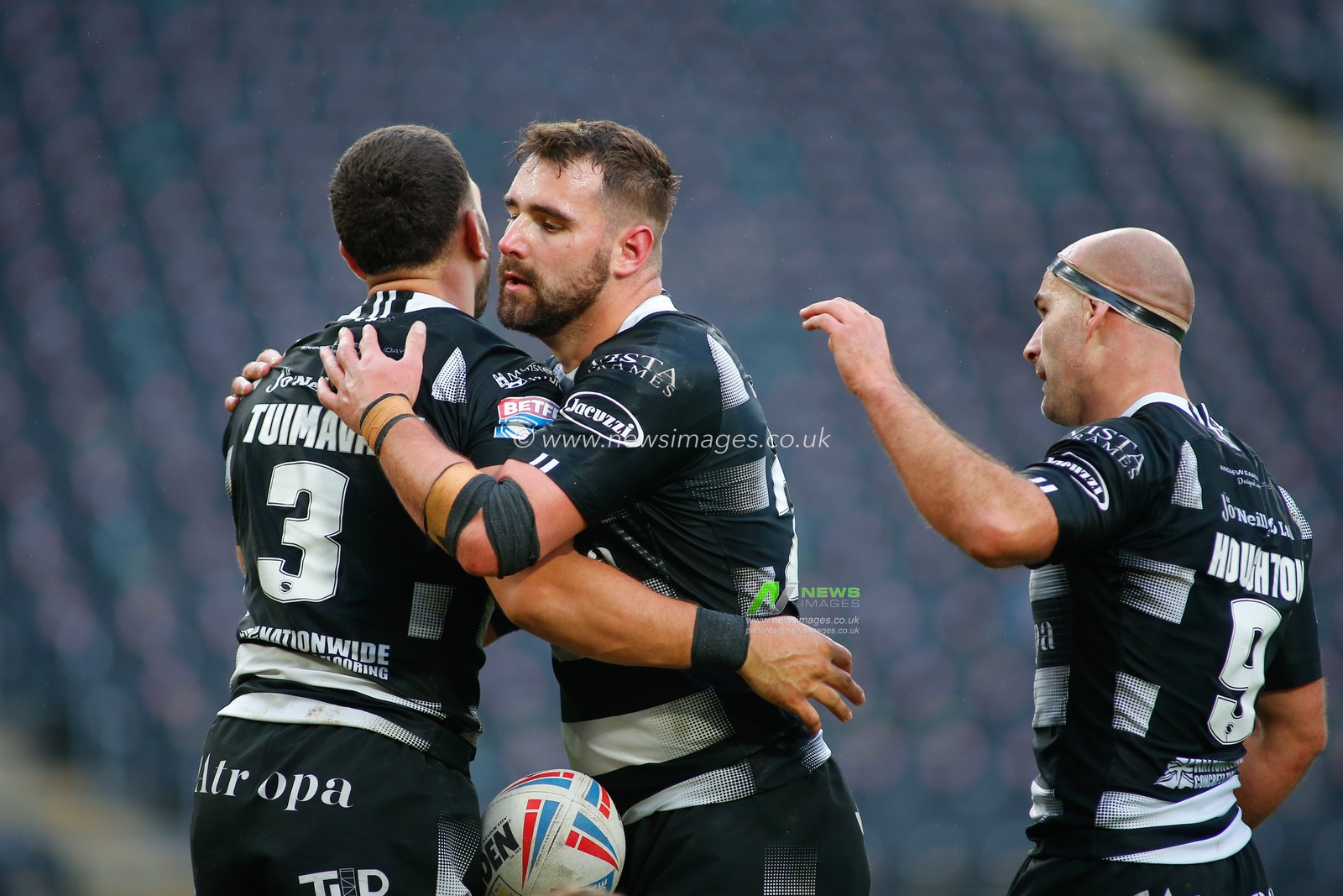 Carlos Tuimavave (3) of Hull FC celebrates scoring the try alongside his team mates.
