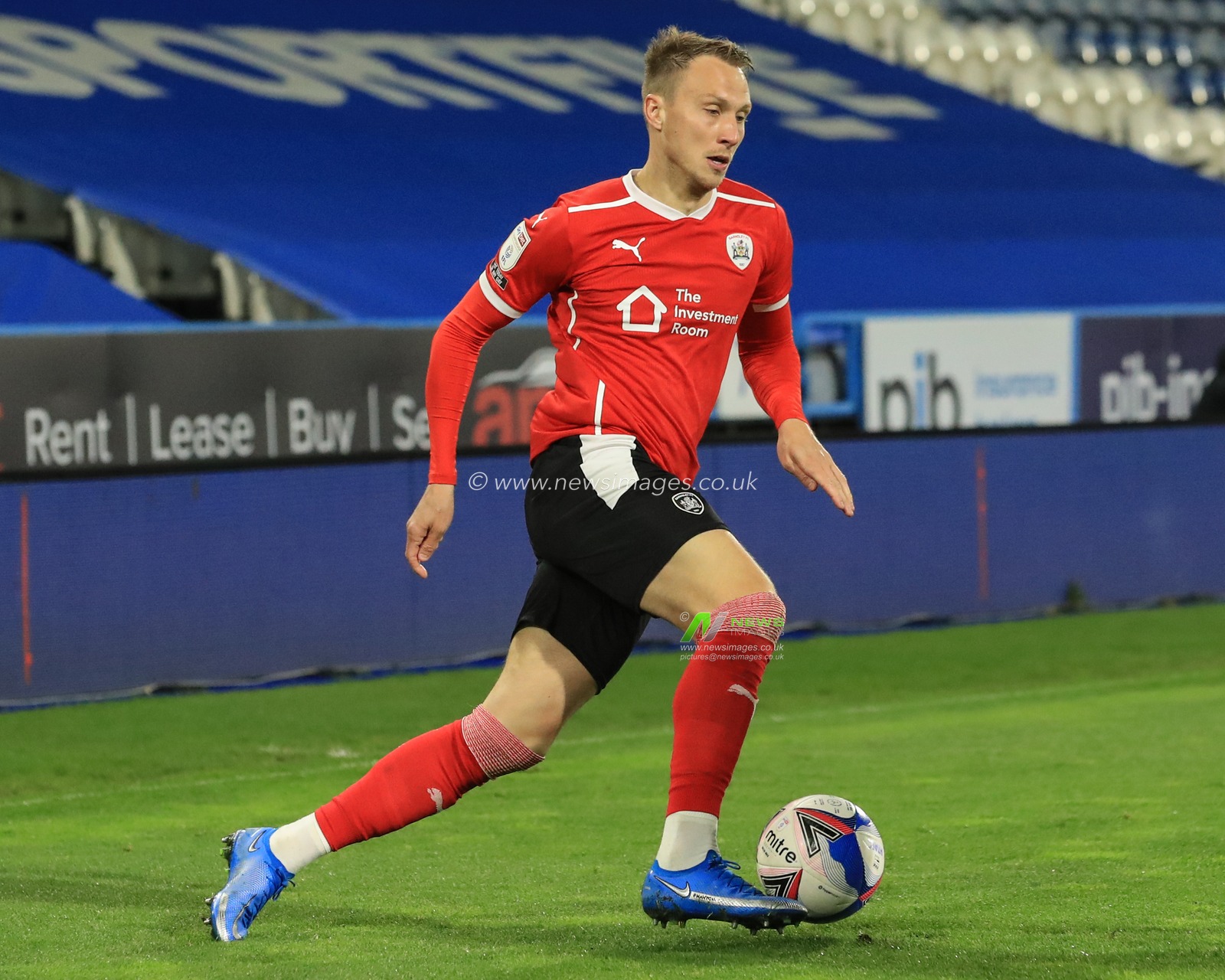 Cauley Woodrow #9 of Barnsley in action during the game