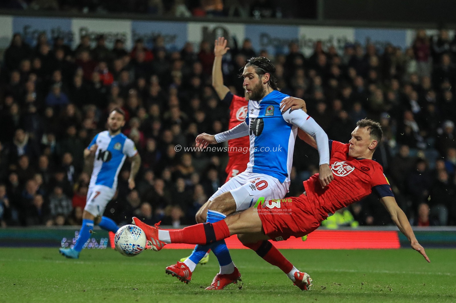 23rd December 2019, Ewood Park, Blackburn, England; Sky Bet Championship, Blackburn Rovers v Wigan Athletic : Kal Naismith (33) of Wigan Athletic slides in to win the ball from Danny Graham (10) of Blackburn Rovers 

Credit: Mark Cosgrove/News Images