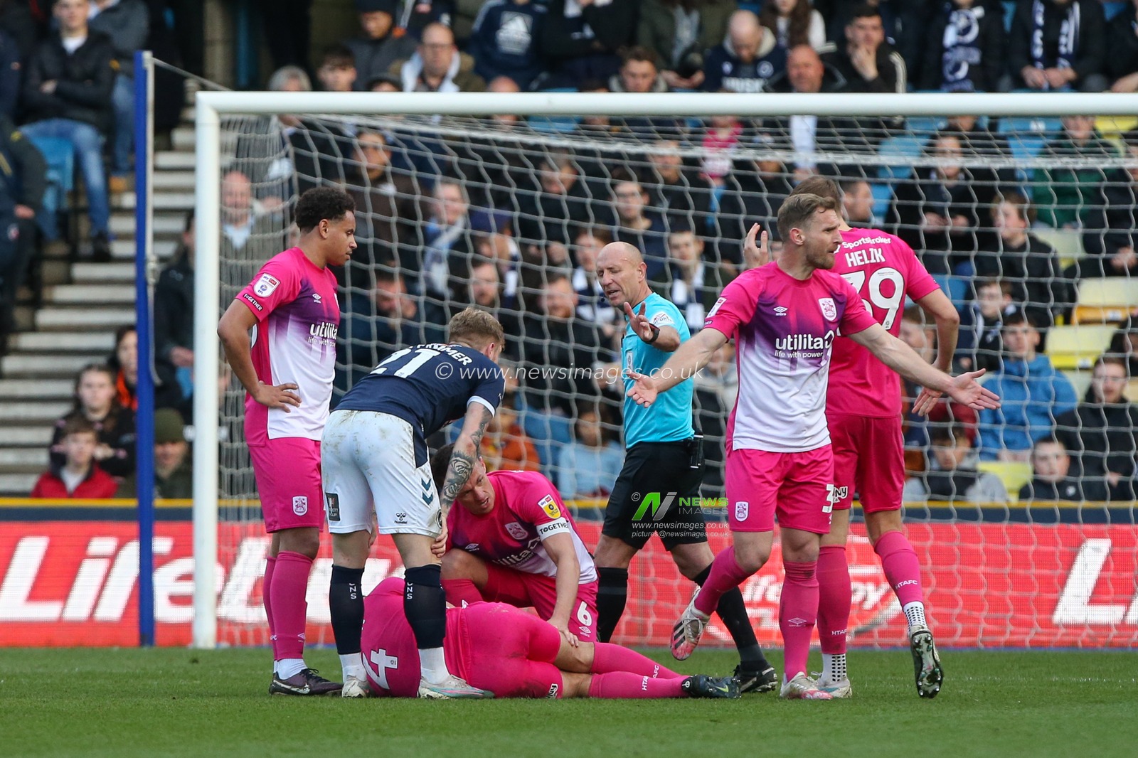 Matty Pearson #4 of Huddersfield Town lays injured during the Sky Bet Championship match Millwall vs Huddersfield Town at The Den, London, United Kingdom, 18th March 2023

(Photo by Arron Gent/News Images)