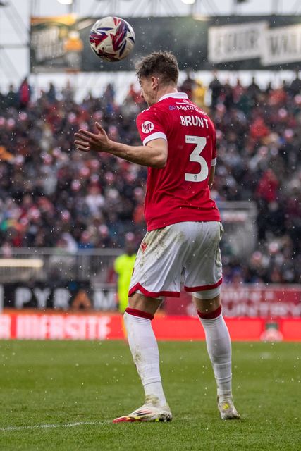 Wrexham's Lewis Brunt heads the ball during the Sky Bet League 1 match Wrexham vs Stockport County at SToK Cae Ras, Wrexham, United Kingdom, 22nd March 2025

(Photo by Nik Mesney/News Images)