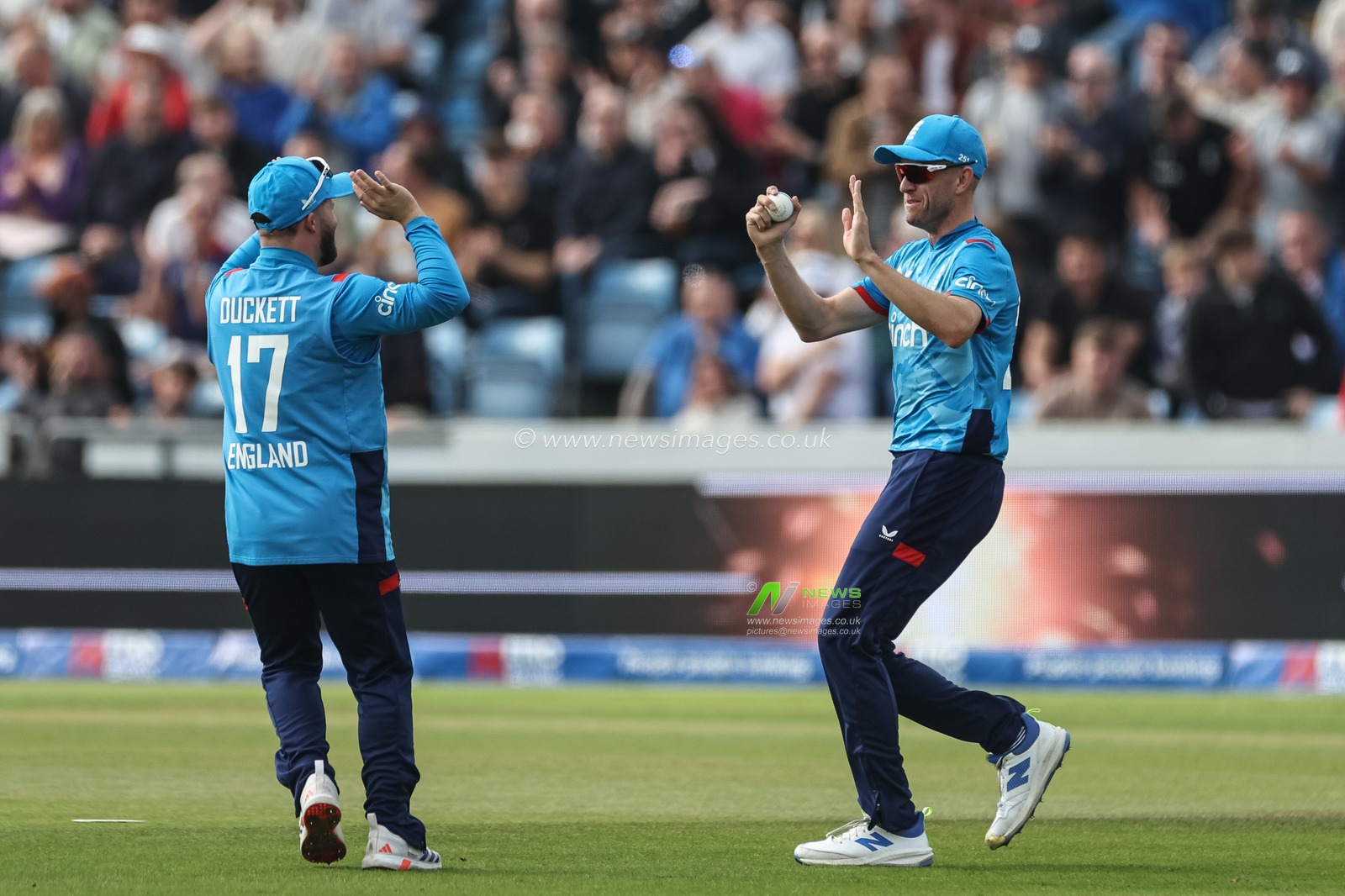 Olly Stone of England celebrates catching out Travis Head of Australia with Ben Duckett of England  during the Second Metro Bank One Day International England v Australia at Headingley Cricket Ground, Leeds, United Kingdom, 21st September 2024

(Photo by Mark Cosgrove/News Images)