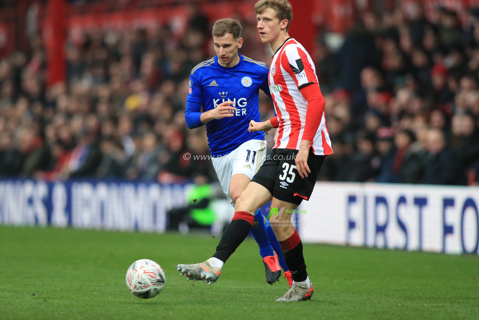 25th January 2020, Griffin Park, London, England; Emirates FA Cup, Brentford v Leicester City : Marc Albrighton (11) of Leicester City and Mads Roersley of Brentford
