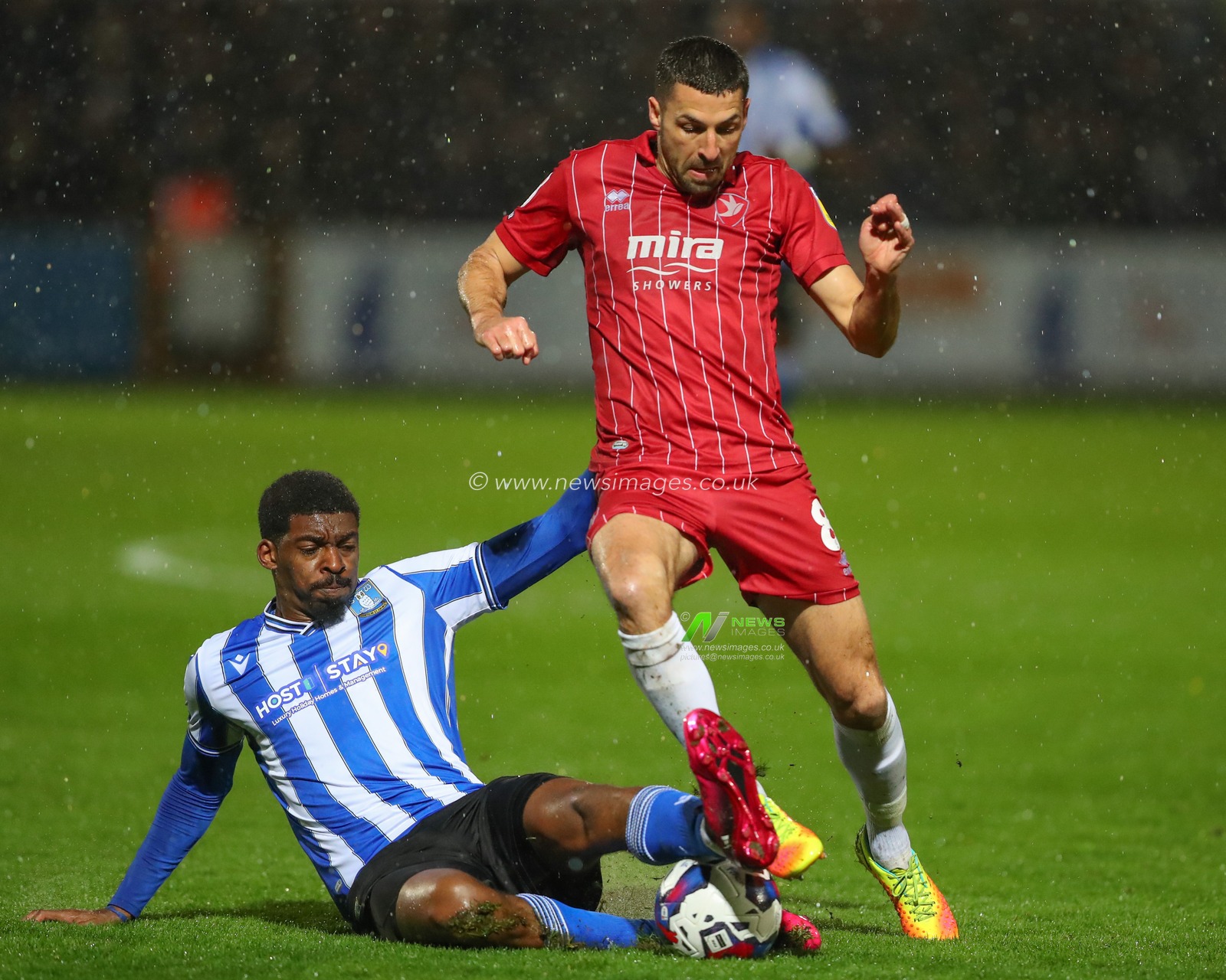 Tyreeq Bakinson #19 of Sheffield Wednesday fouls Liam Sercombe #8 of Cheltenham Town during the Sky Bet League 1 match Cheltenham Town vs Sheffield Wednesday at The Completely-Suzuki Stadium, Cheltenham, United Kingdom, 29th March 2023

(Photo by Gareth Evans/News Images)