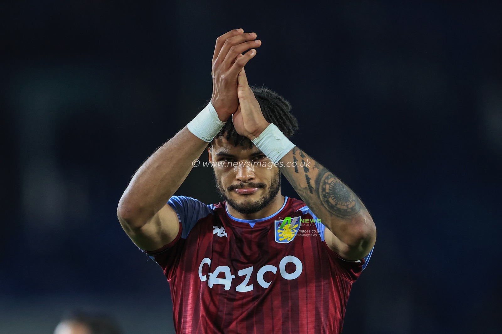 Tyrone Mings #5 of Aston Villa applauds the fans