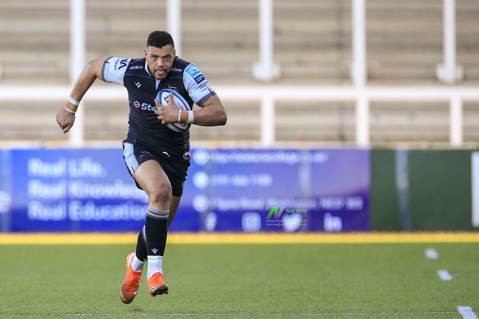 Luther Burrell of Newcastle Falcons carrying the ball forward