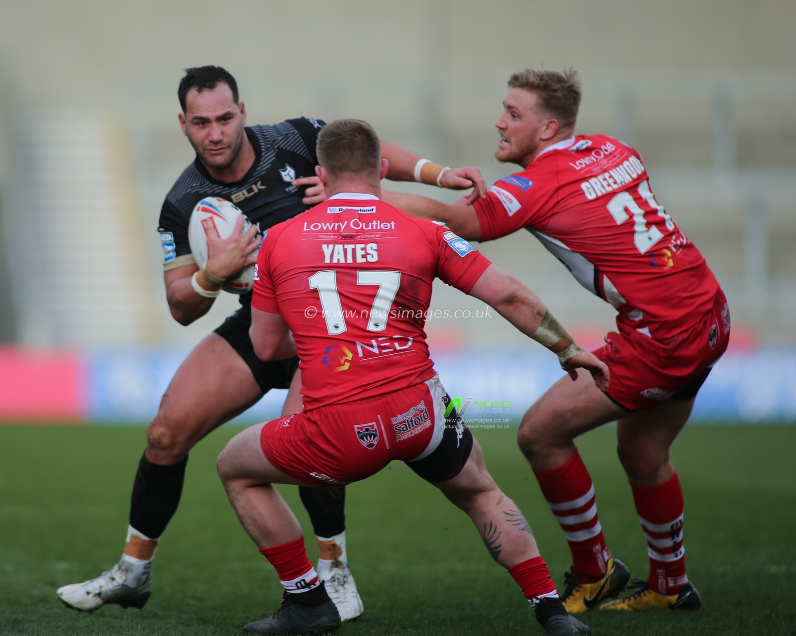 8th February 2020, AJ Bell Stadium, Eccles, England; Betfred Super League, Salford Red Devils v Toronto Wolfpack : Bodene Thompson of Toronto Wolfpack takes on Luke Yates and James Greenwood of Salford Red Devils.