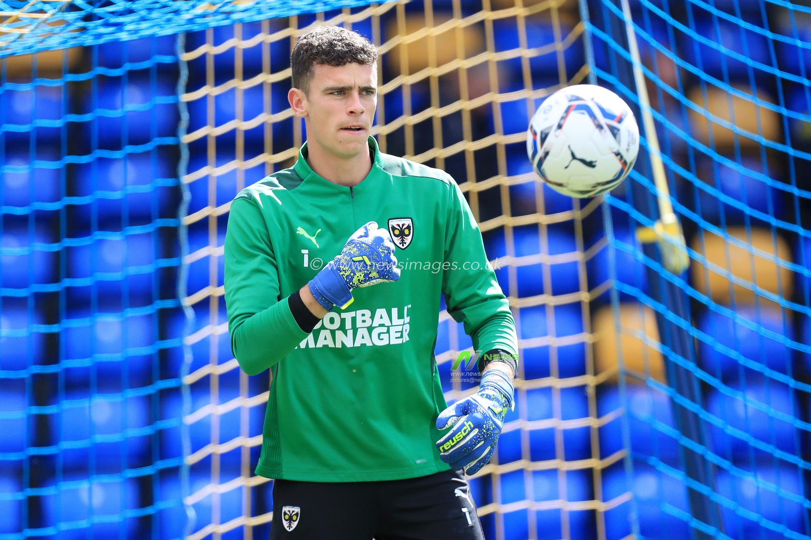 Nik Tzanev #1 of AFC Wimbledon warms up.