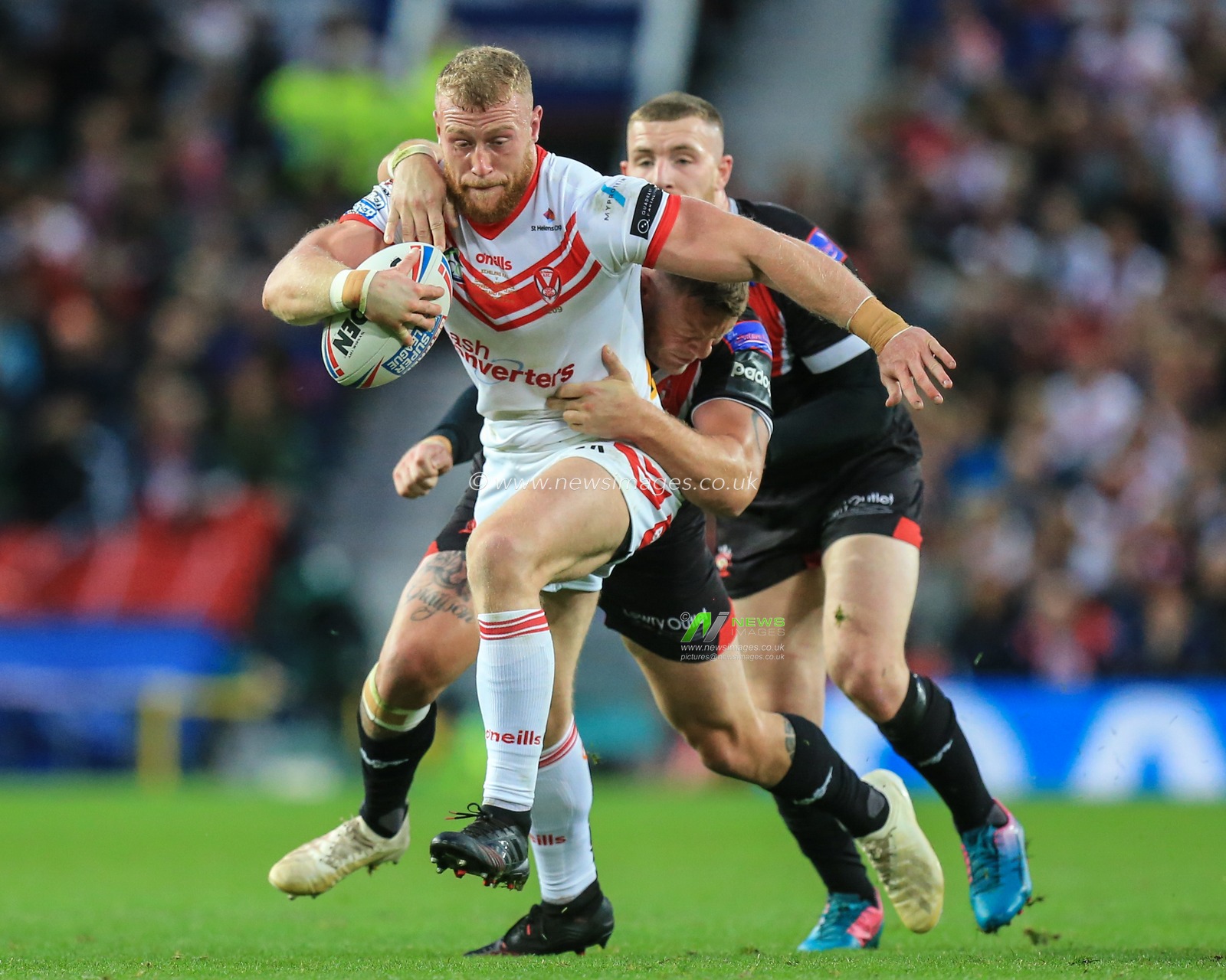 12th October 2019, Old Trafford, Manchester, England; The Grand Final 2019, Saint Helens v Salford Red Devils :Luke Thompson (10) of St Helens is stopped by the Salford defence

Credit: David Greaves/News Images