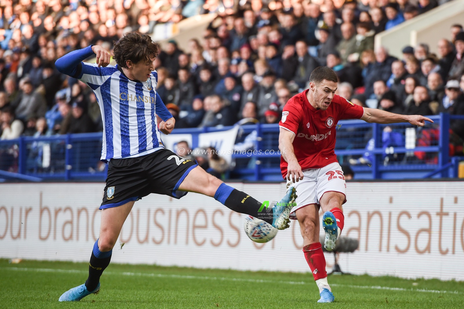 22nd December 2019, Hillsborough, Sheffield, England; Sky Bet Championship, Sheffield Wednesday v Bristol City : 
Tommy Rowe (25) of Bristol City whips a cross in despite the attention of Adam Reach (20) of Sheffield Wednesday 
Credit: Dean Williams/News Images