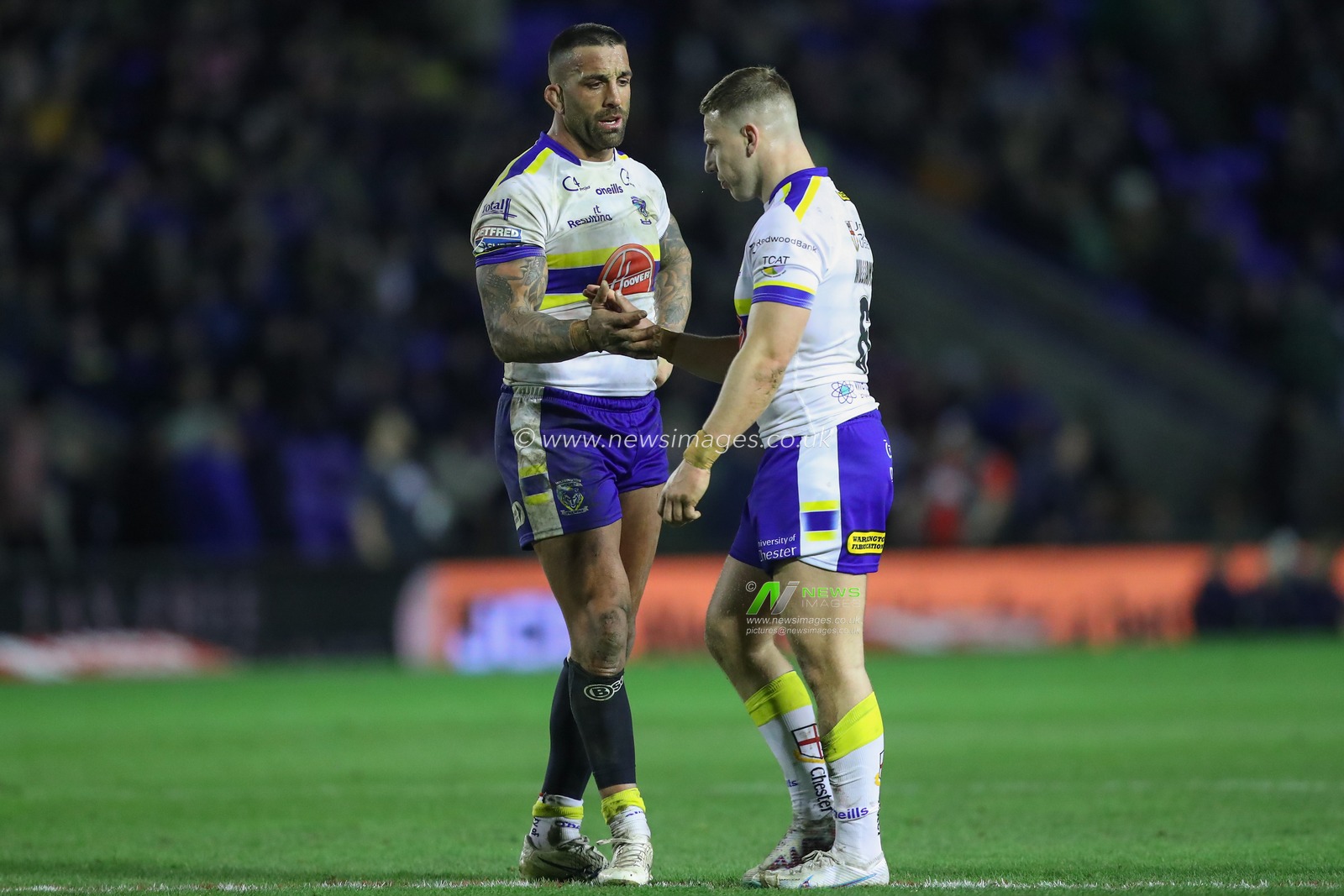 Paul Vaughan #10 of Warrington Wolves and George Williams #6 of Warrington Wolves high five during the Betfred Super League Round 1 match Warrington Wolves vs Leeds Rhinos at Halliwell Jones Stadium, Warrington, United Kingdom, 16th February 2023

(Photo by Gareth Evans/News Images)