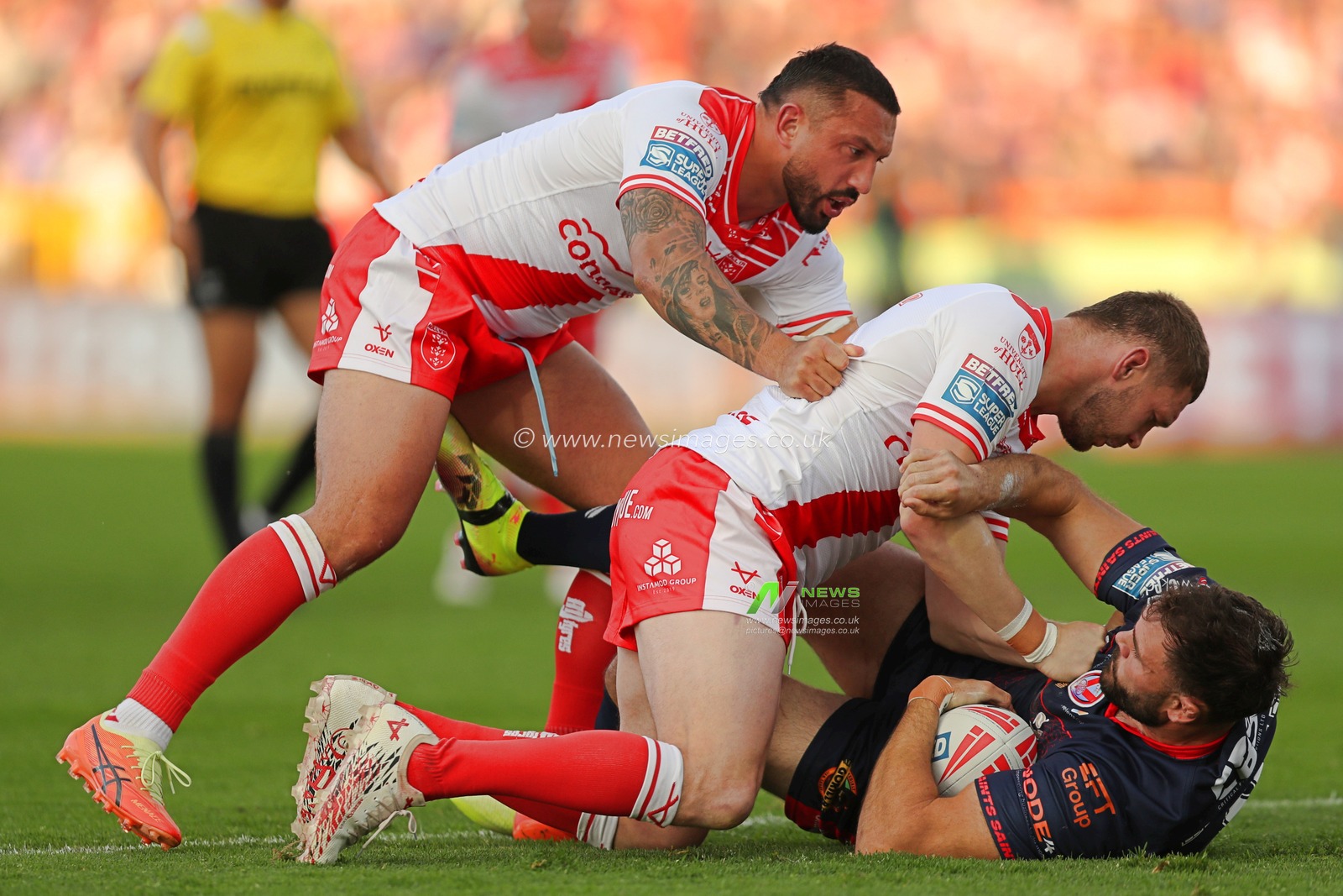 Elliot Minchella and James Batchelor of Hull KR tackle Alex Walmsley of St. Helens during the Betfred Super League Round 13 match Hull KR vs St Helens at Sewell Group Craven Park, Kingston upon Hull, United Kingdom, 30th May 2025(Photo by Sam Eaden/News Images)