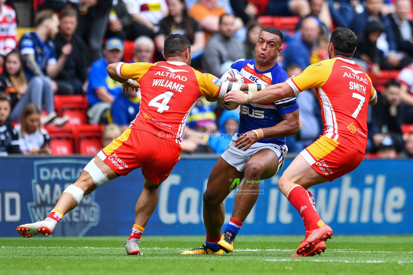 25th May 2019 , Anfield Stadium, Liverpool, England; Dacia Magic Weekend, Betfred Super League Round 16, Wakefield Trinity vs Catalans Dragons ; Reece Lyne (4) of Wakefield Trinity is tackled by Brayden Wiliame (4) of Catalans Dragons 

Credit: Craig Thomas/News Images