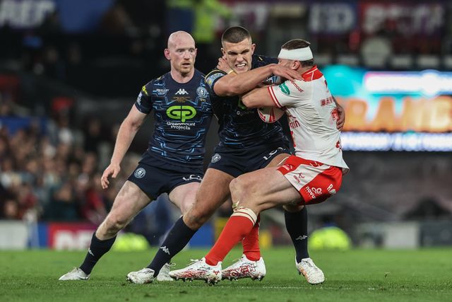 James Batchelor of Hull KR is tackled by Brad O'neill of Wigan Warriors during the 2025 Betfred Super League Grand Final Hull KR v Wigan Warriors at Old Trafford, Manchester, United Kingdom, 11th October 2025

(Photo by Alfie Cosgrove/News Images)