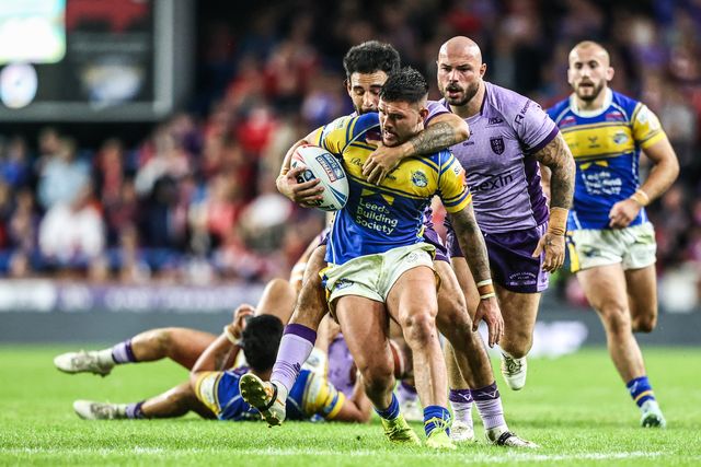 Keenan Palasia of Leeds Rhinos is tackled during the Betfred Super League round 23 match Leeds Rhinos vs Hull KR at Headingley Stadium, Leeds, United Kingdom, 21st August 2025

(Photo by Alfie Cosgrove/News Images)