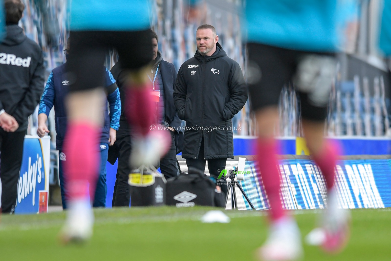 Wayne Rooney manager of Derby County watches the warm up