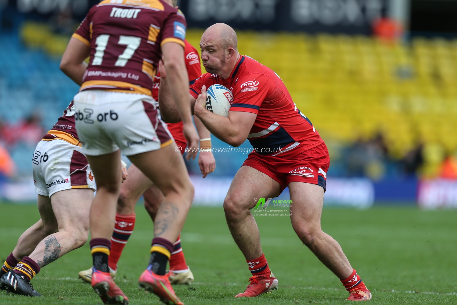 George King #10 of Hull KR runs at the Huddersfield defence