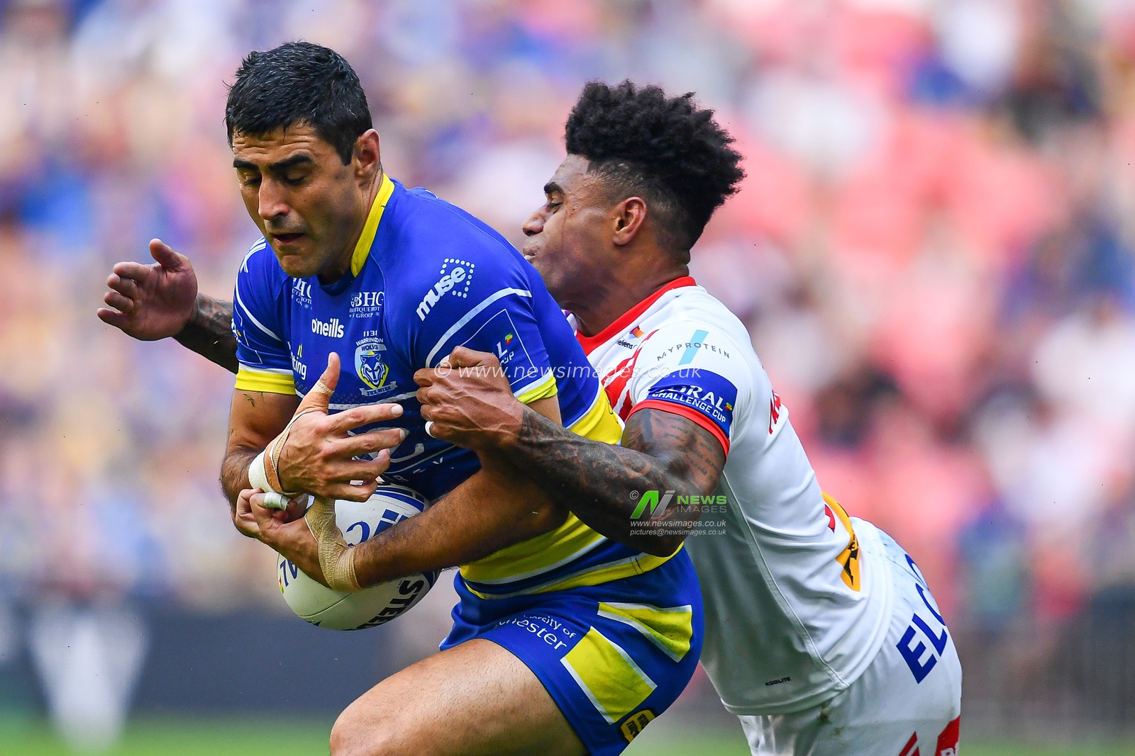 24th August 2019 , Wembley Stadium, London England ; 2019 Coral Challenge Cup Final ; St Helens vs Warrington Wolves ; Bryson Goodwin of Warrington Wolves is tackled by Kevin Naiqama (3) of St Helens 



Credit: Craig Thomas/News Images