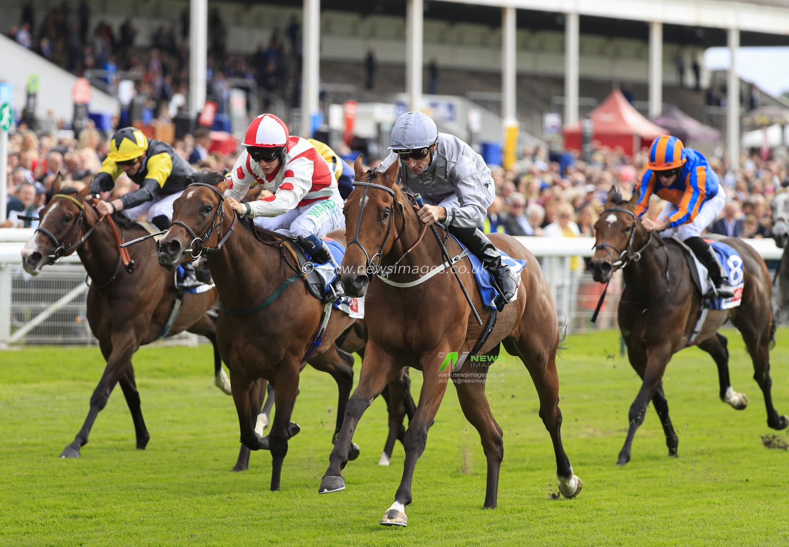 22nd August 2019 , York Racecourse, York, Great Britain; 2019 Darley Yorkshire Oaks/Ladies Day ; Living In The Past ridden by Daniel Tudhope (grey colours) runs on to win The Sky Bet Lowther Stakes

Credit Conor Molloy/News Images