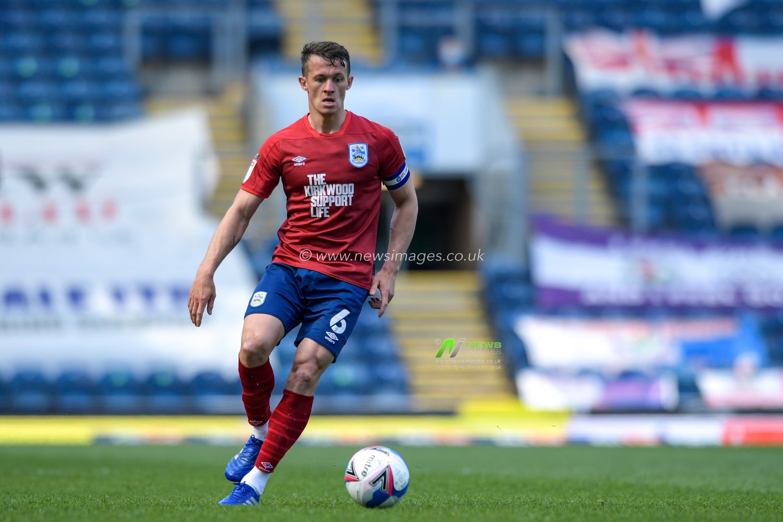 Jonathan Hogg #6 of Huddersfield Town runs with the ball